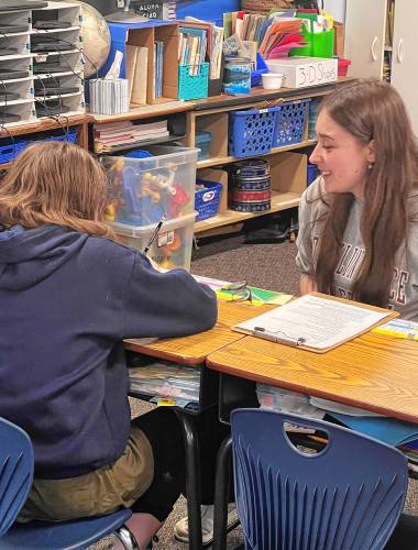 FPU student Liela Irwin works with a Rindge Memorial School student in the Writing Nest.