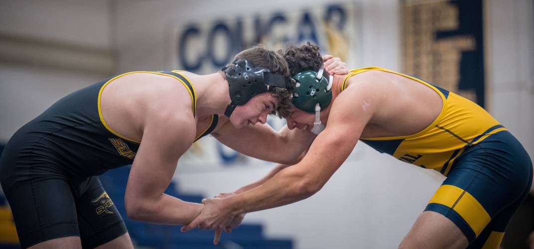 ConVal senior Drake Bay locks arms with his opponent. 
