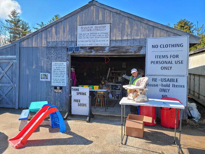 Antrim Community Board volunteer Mary Devine indicates the entrance of the newly reorganized  and reopened swap shop at the Antrim Recycling Center. 