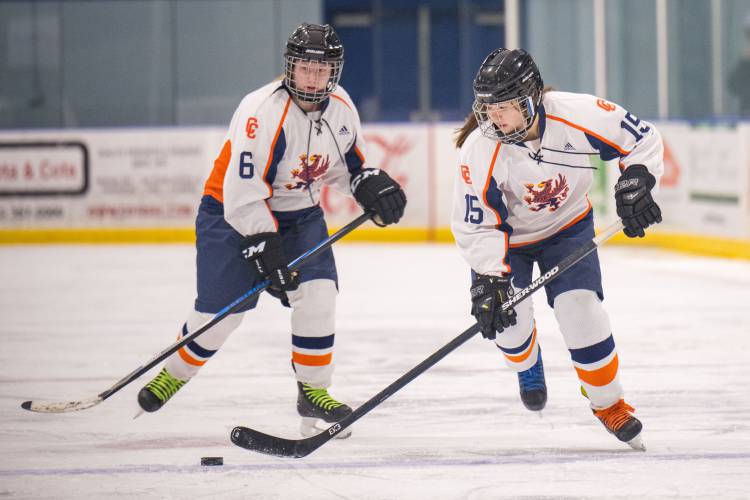  ConVal-Conant's Miranda Ellis, left, and Aerowyn Schwartz carry the puck up the ice. 