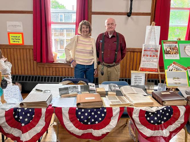 Priscilla Shook and Neil Brown of the Antrim Historical Society at the community fair on June 3. 