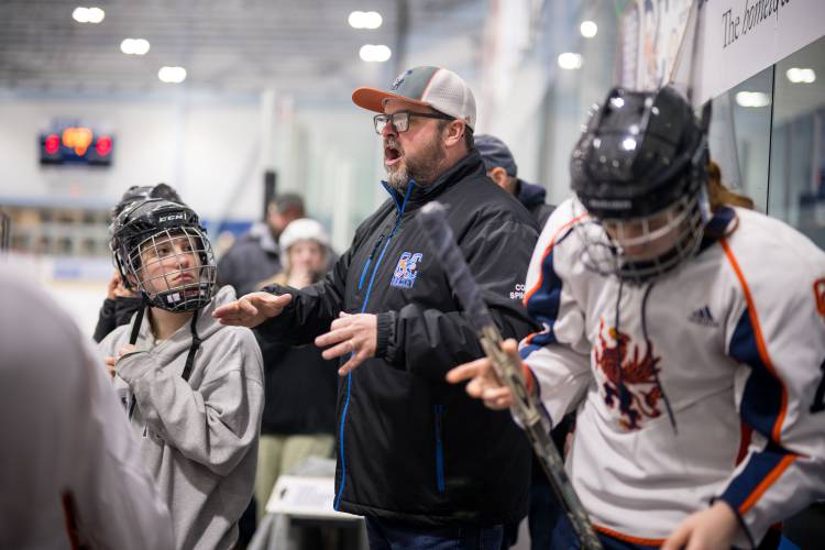 ConVal-Conant girls' hockey coach Chris Spingola instructs his team before the Griffins' 5-1 loss to visiting Manchester Central-West-Memorial in Keene on Saturday, Jan. 13.