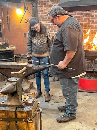 Monica Lehner, left, in class with Vinnie Anfuso at the Greenfield Forge. 
