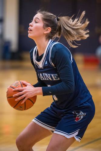 Sera Hodgson shoots a three-pointer against UNH  on Jan. 11. She finished the game with two points, three rebounds and a steal in Maine’s 78-52 win.