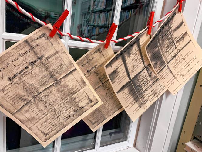 Copies of love letters and poems from Mason residents, pulled from historical archives, are on display at the Mason Public Library.