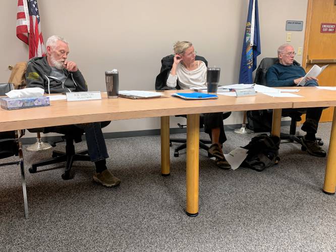Rindge Select Board members Bob Hamilton, Marybeth Quill and Karl Pruter discuss the budget during a public hearing on Wednesday.