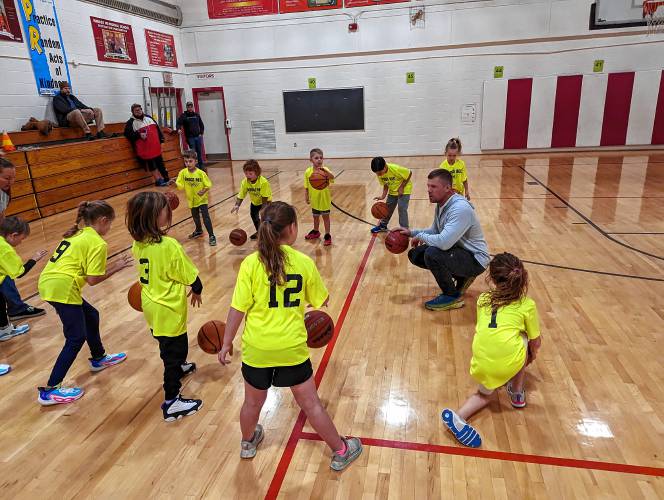 Coach Jamie Vandyke gives instruction to his first- and second-grade team.