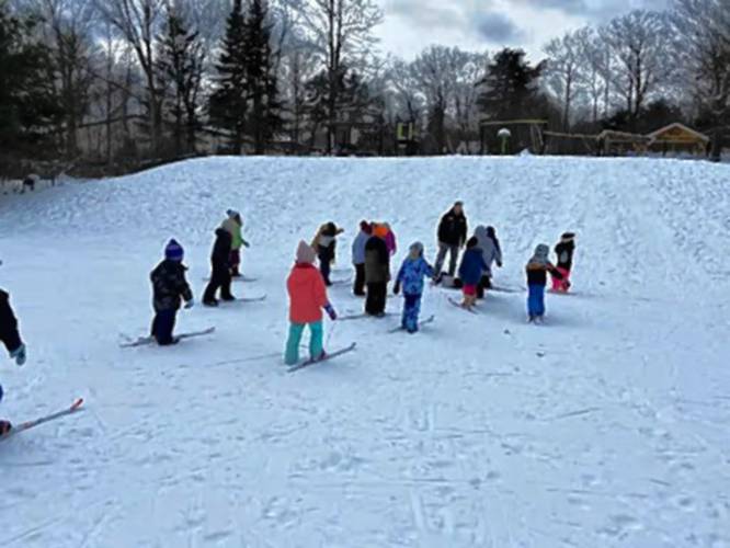 Dublin Consolidated students travel up the hill using one ski as they learn to travel over different kinds of terrain.